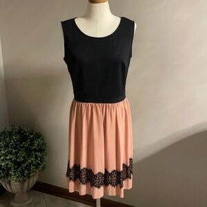 Women’s juniors sleeveless dress. Stretchy top, double layer bottom. Size 12